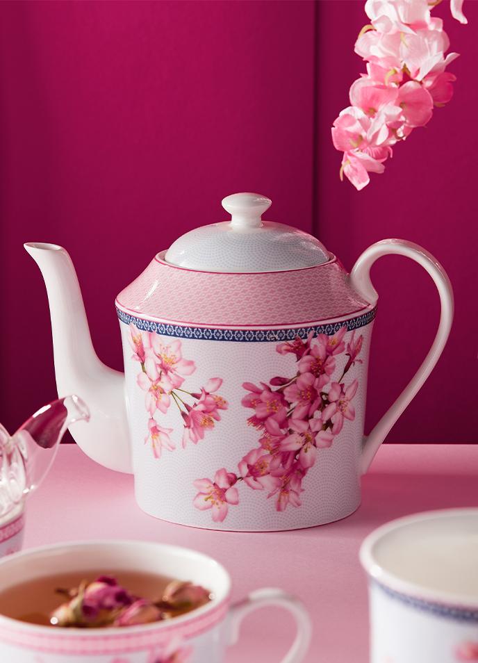 Teapot featuring delicate pink cherry blossoms